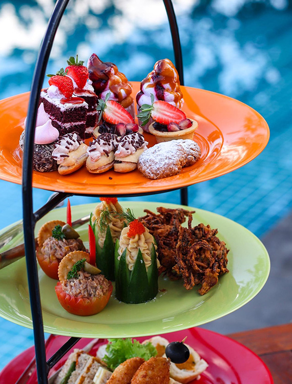 High tea platter by the pool at Aarunya Resort