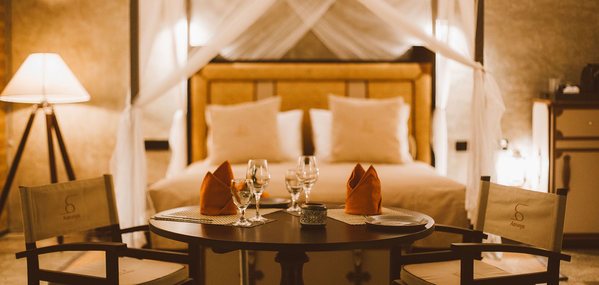 Interior and king sized bed at Aarunya Nature Resort