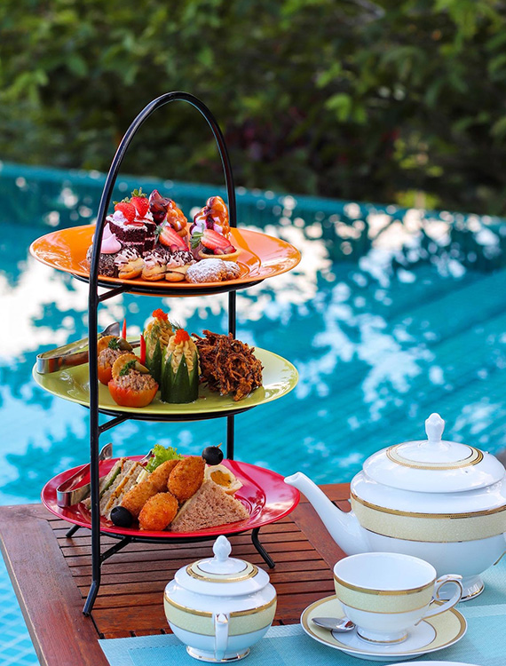High tea platter by the pool at Aarunya Resort