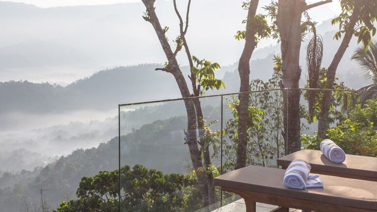 View of hills from the balcony of a villa at Aarunya Nature Resort