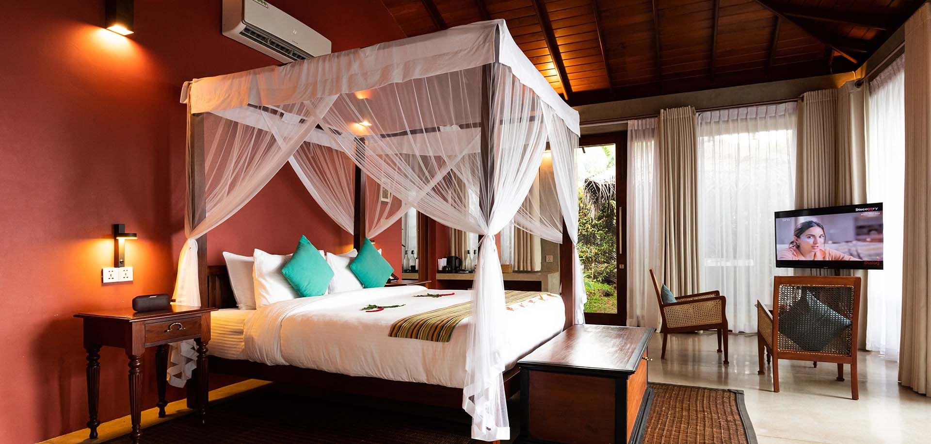 Comfort king size bed and modern amenities at Aarunya Nature Resort