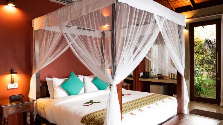 Comfort king size bed with views at Aarunya Nature Resort