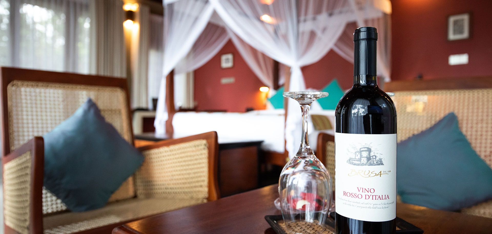 Bottle of wine with a glass at Aarunya Nature Resort Villa