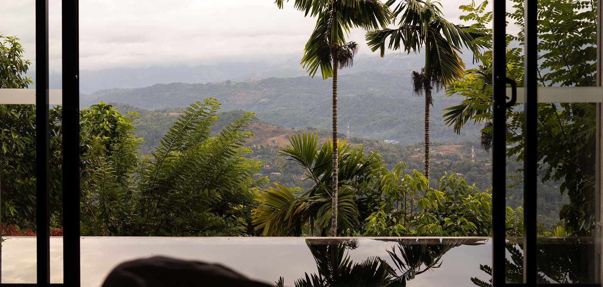 Outdoor pool with scenic views at Aarunya Nature Resort 
