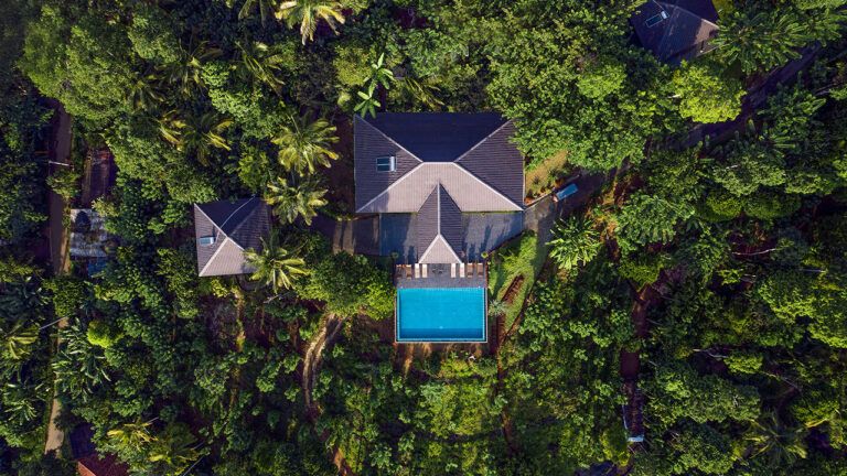 Aerial view of the Aarunya Nature Resort villa surrounded by lush greenery