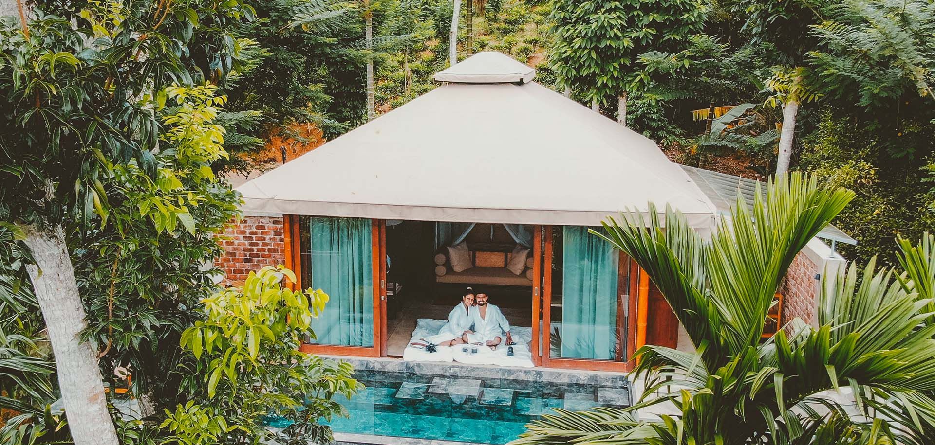 Ariel view of couple relaxing in a private pool villa at Aarunya Nature Resort