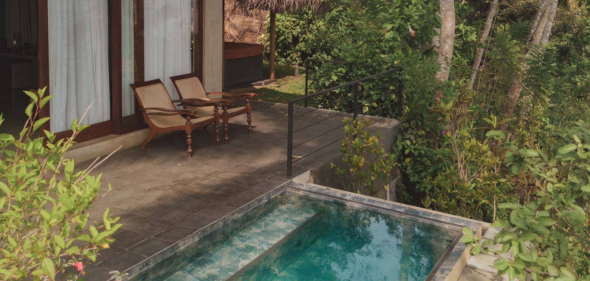Outdoor terrace with a pool at Aarunya Nature Resort Villa