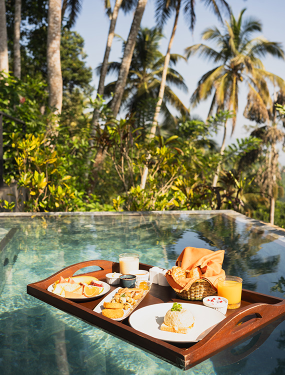 Floating breakfast served in a private plunge pool at Aarunya Nature Resort