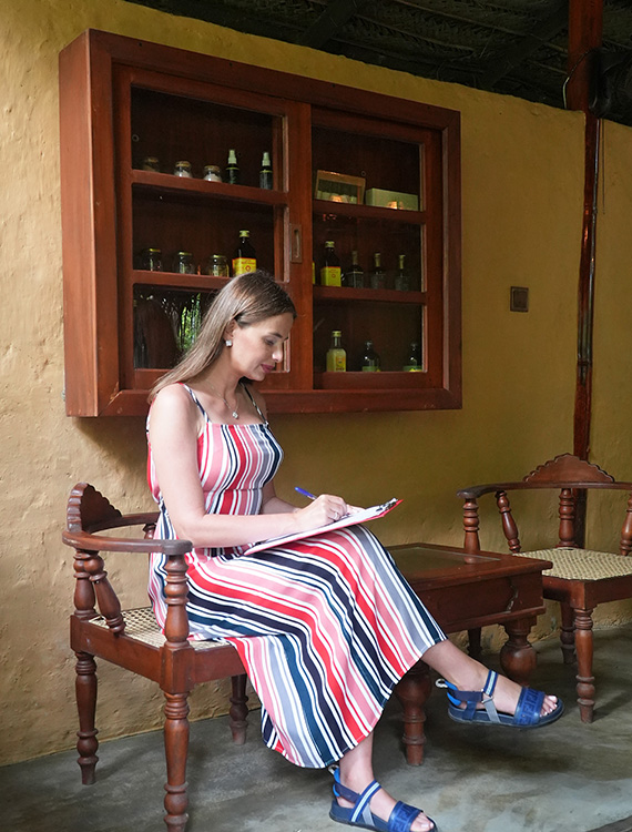 Guest reading a book in a peaceful setting at Aarunya Nature Resort 
