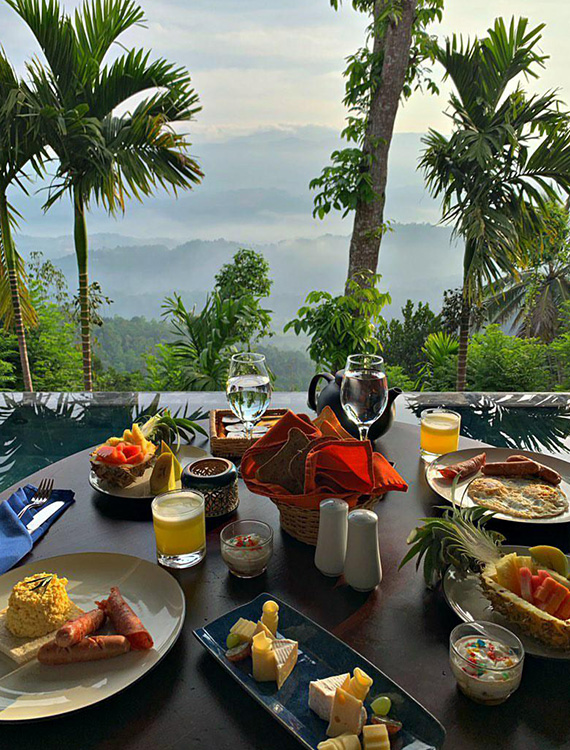 Delicious breakfast spread set amidst stunning backdrop at Aarunya Nature Resort