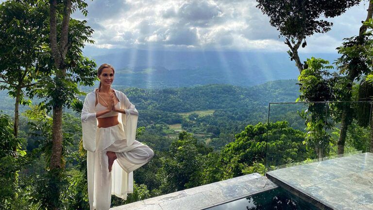 Guest practicing yoga with a view at Aarunya Nature Resort