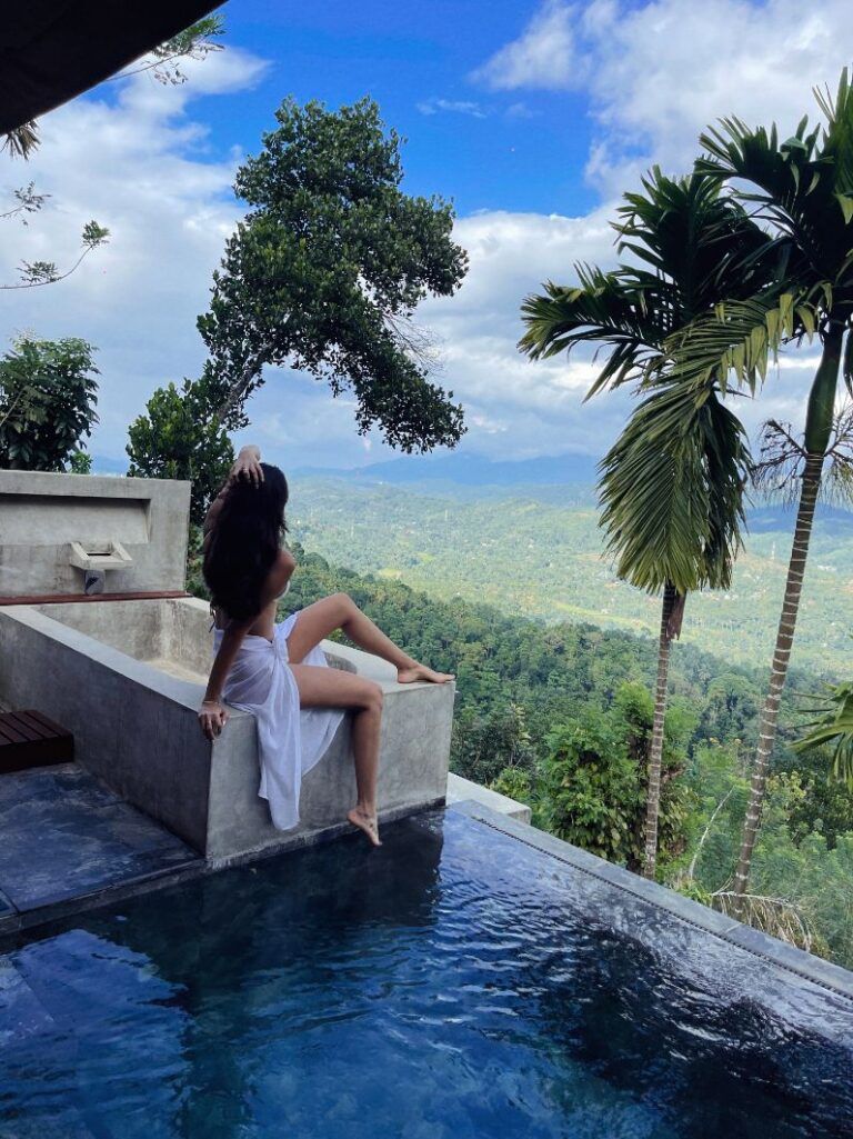 Guest enjoying scenic view from a private pool at Aarunya Resort