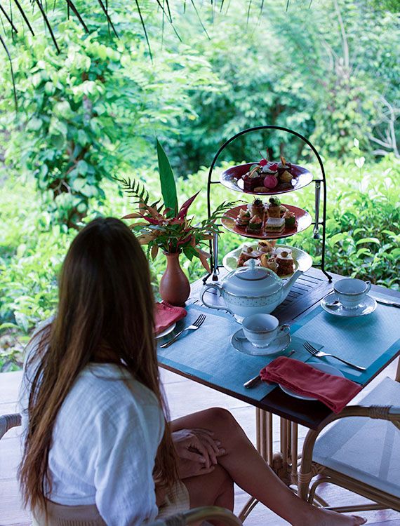 Guest enjoying high tea at the Aahaasa Tea Pavilion