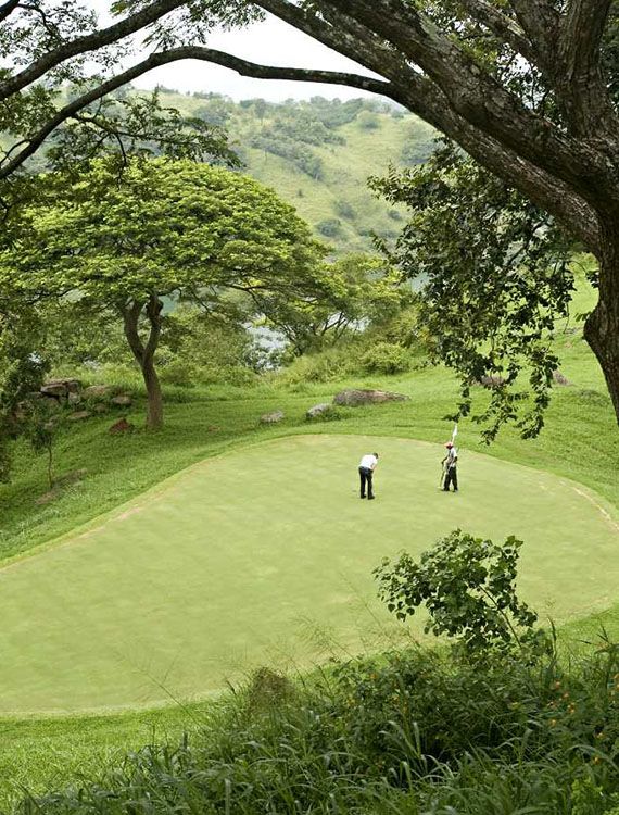 Aerial shot of two golfers on the course at Victoria Golf Club in Kandy