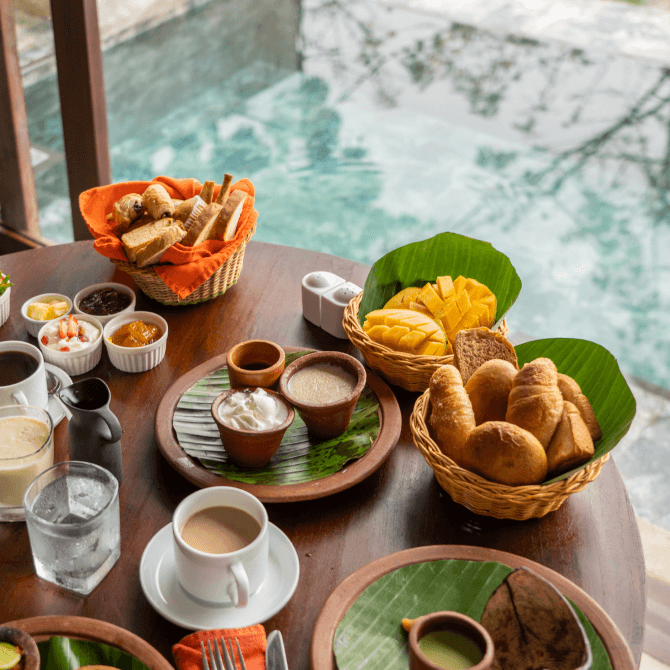 Traditional Sri Lankan dishes by the pool at Aarunya Nature Resort