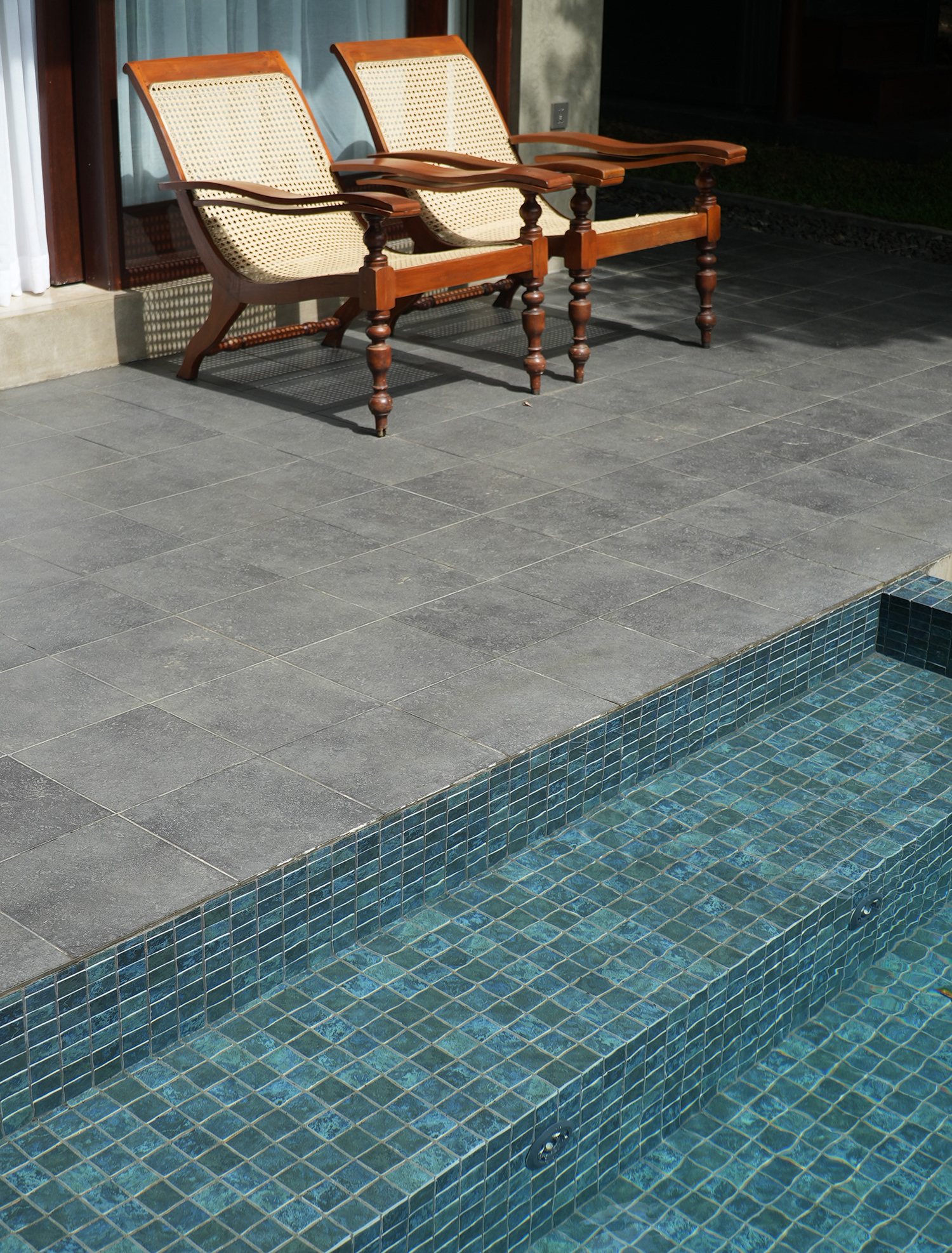 Outdoor pool with loungers at Aarunya Nature Resort Villa