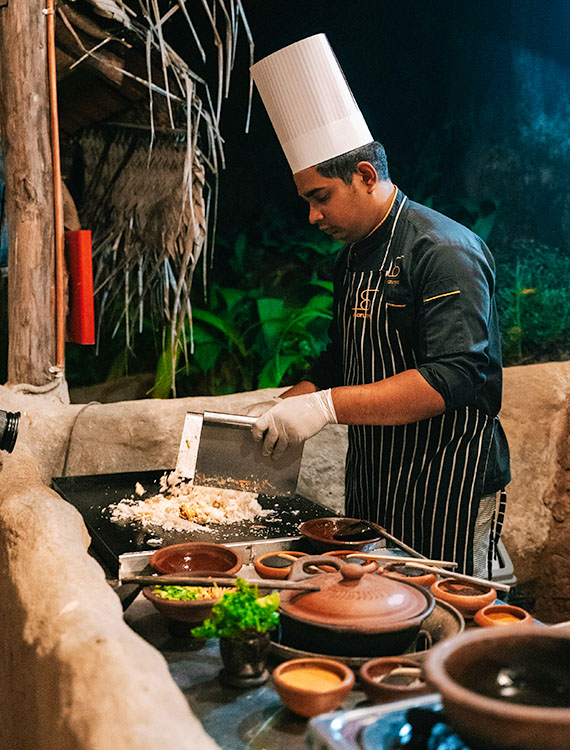Chef prepares kottu at Aarunya Nature Resort