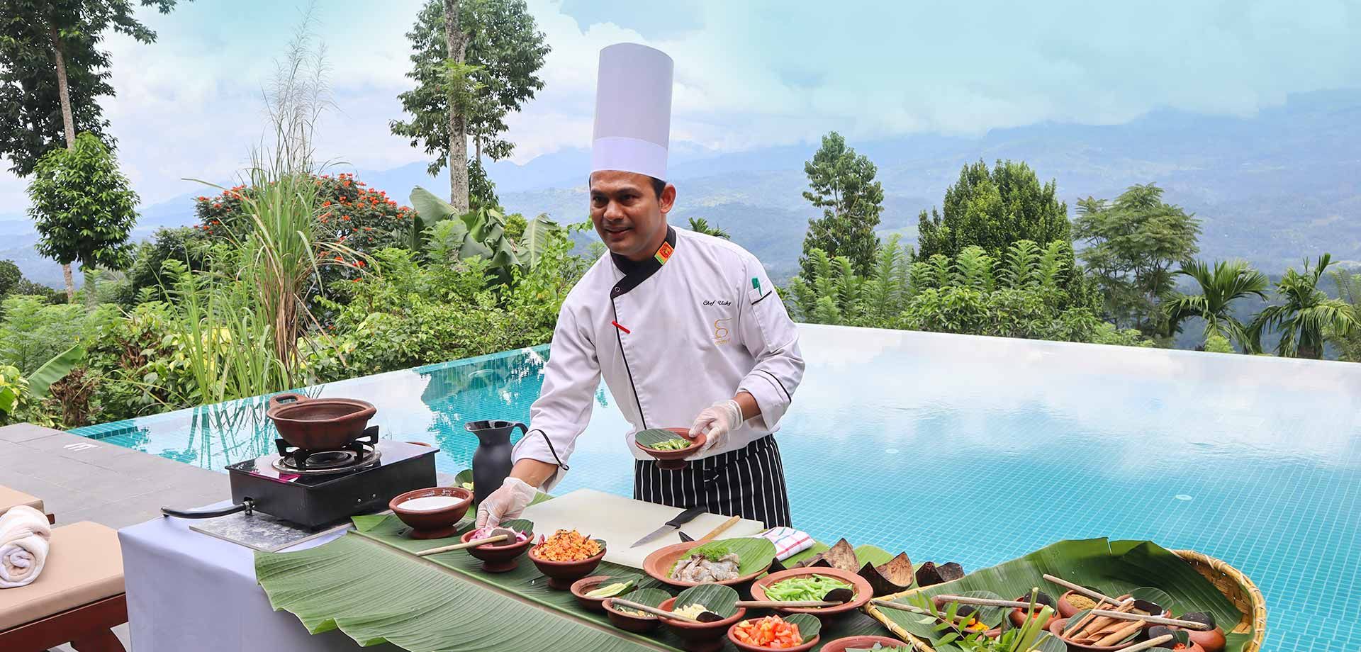 Chef presenting local ingredients during cooking class at Aarunya Nature Resort