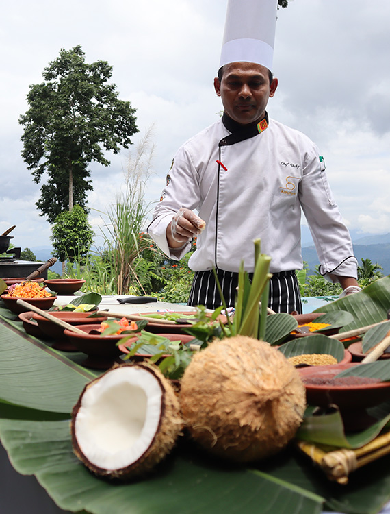Chef preparing exquisite Sri Lankan dish at Aarunya