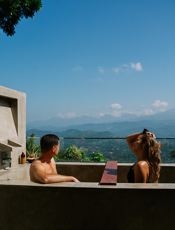 Couple enjoying scenery from a private pool at Aarunya Resort
