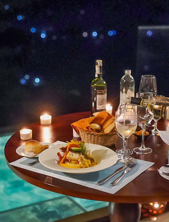 Dinner setup by the pool at Aarunya Nature Resort