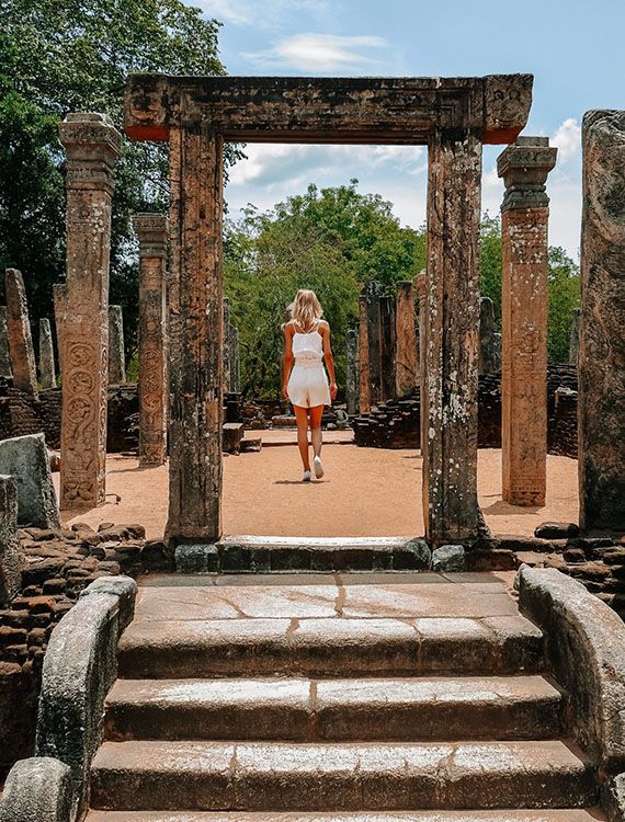 Tourist exploring the Polonnaruwa ancient city ruins