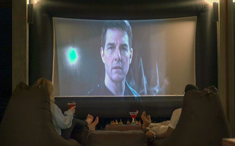 Couple enjoying movie night at Aarunya’s private cinema