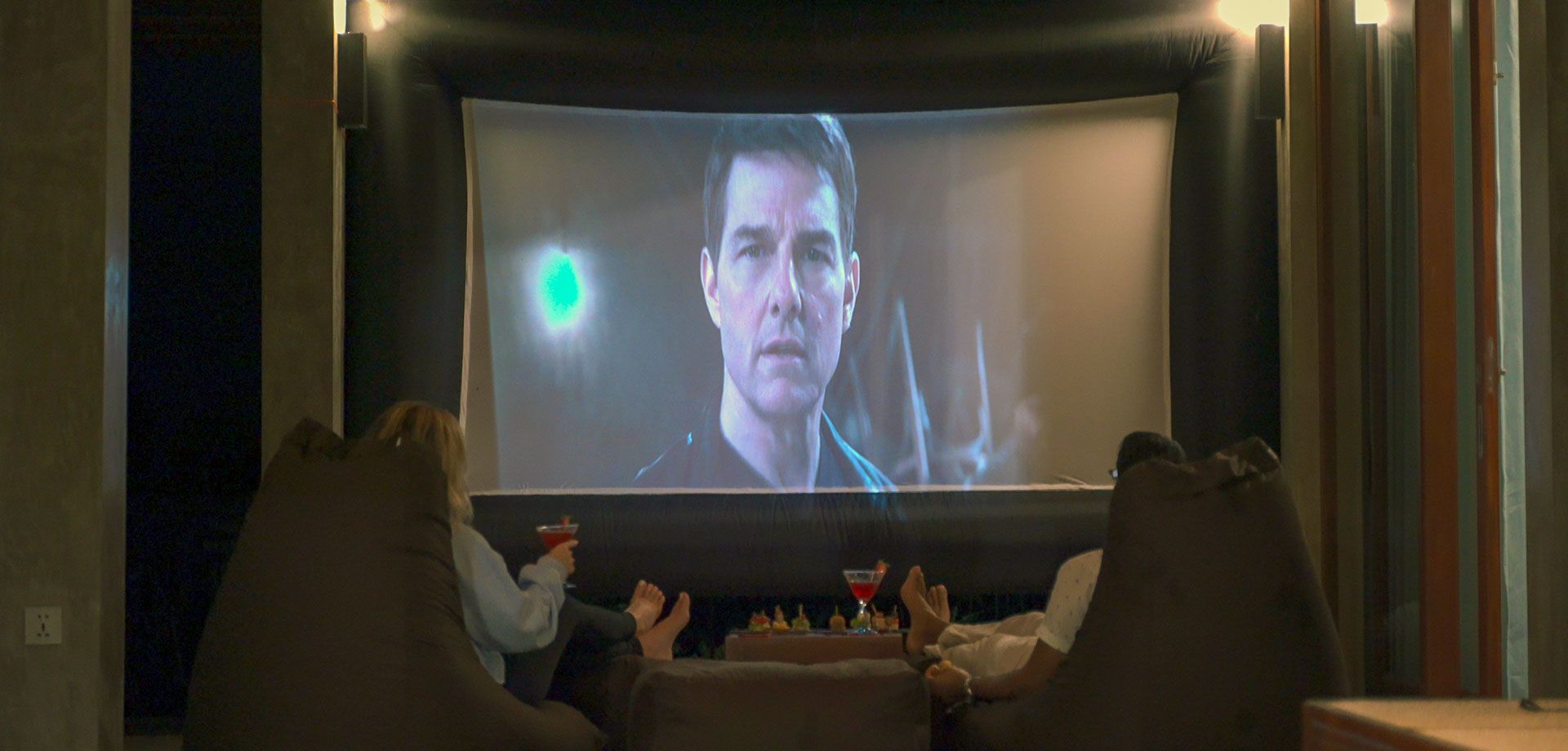 Couple enjoying movie night at Aarunya’s private cinema