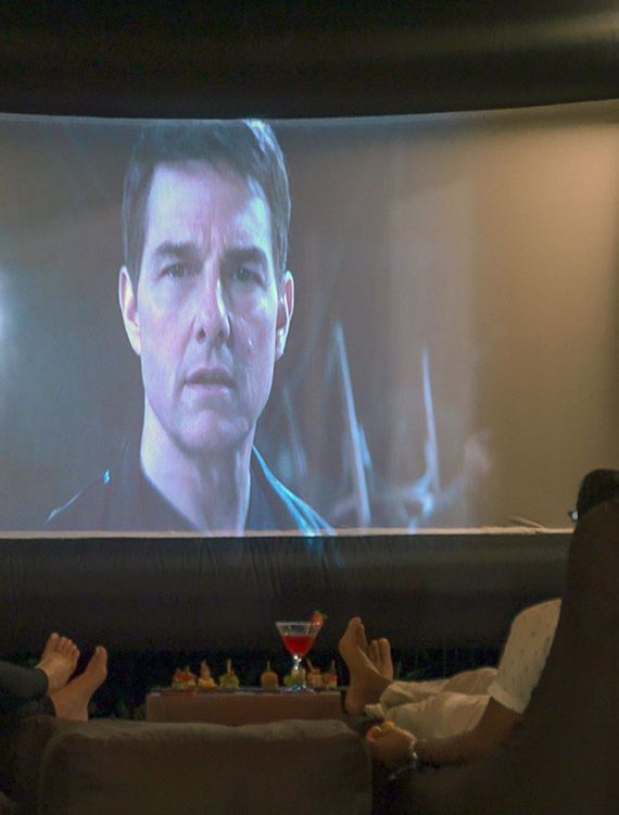 Couple enjoying movie night at Aarunya’s private cinema