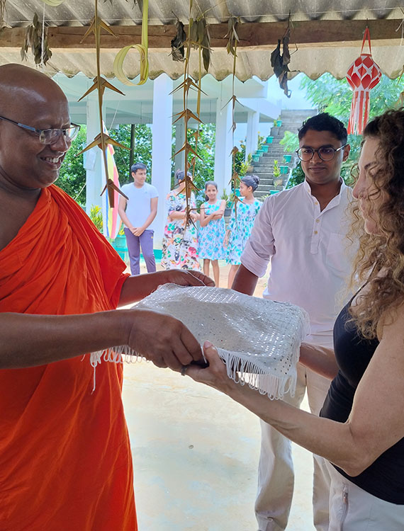 Guest participating in a traditional pooja at Aarunya's Village Temple